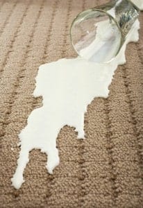 Milk spills can be removed with simple household items.