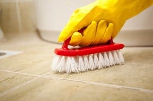 Scrubbing bathroom tile.